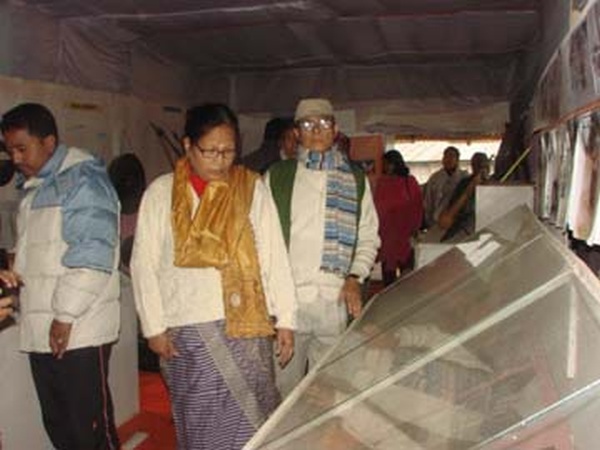 Deputy Director Sushila having a look at the artifacts showcased at the exhibition