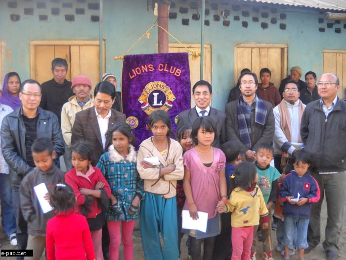 Members of the Lions Club of Kohima (LCK) with Leprosy inmates after handing over items---rice, meat, blankets and other items---to them at Leprosy Colony, Naga Bazar