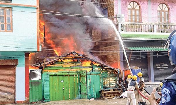 2 houses, shop go up in flames in New Checkon