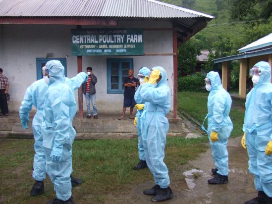  Rapid Response Team in their van visiting various places within the 5km radius of the affected chicken farm after the outbreak of the deadly Bird flu at Imphal on 26 July 2007  