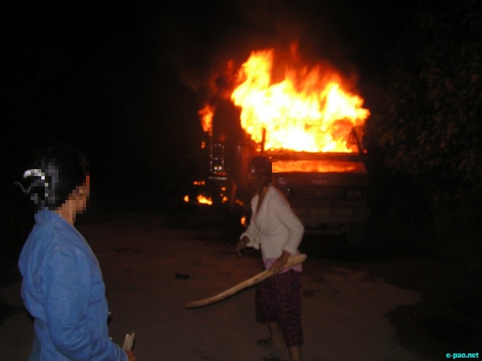 Blockade supporters of Sadar Hills districthood Demand Committee (SHDDC) set ablaze eight goods laden trucks on Saturday night, September 10 2011 at Keithelmanbi, Senapati distirct of Manipur