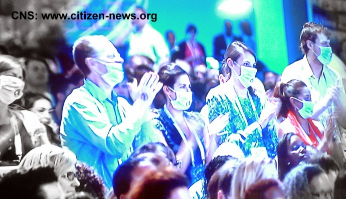 some delegates stood up wearing TB face masks to draw attention to TB continues to be the lead cause of deaths among HIV positive people during US Secretary of State Hillary Rodham Clinton speech at XIX International AIDS Conference in Washington DC 
